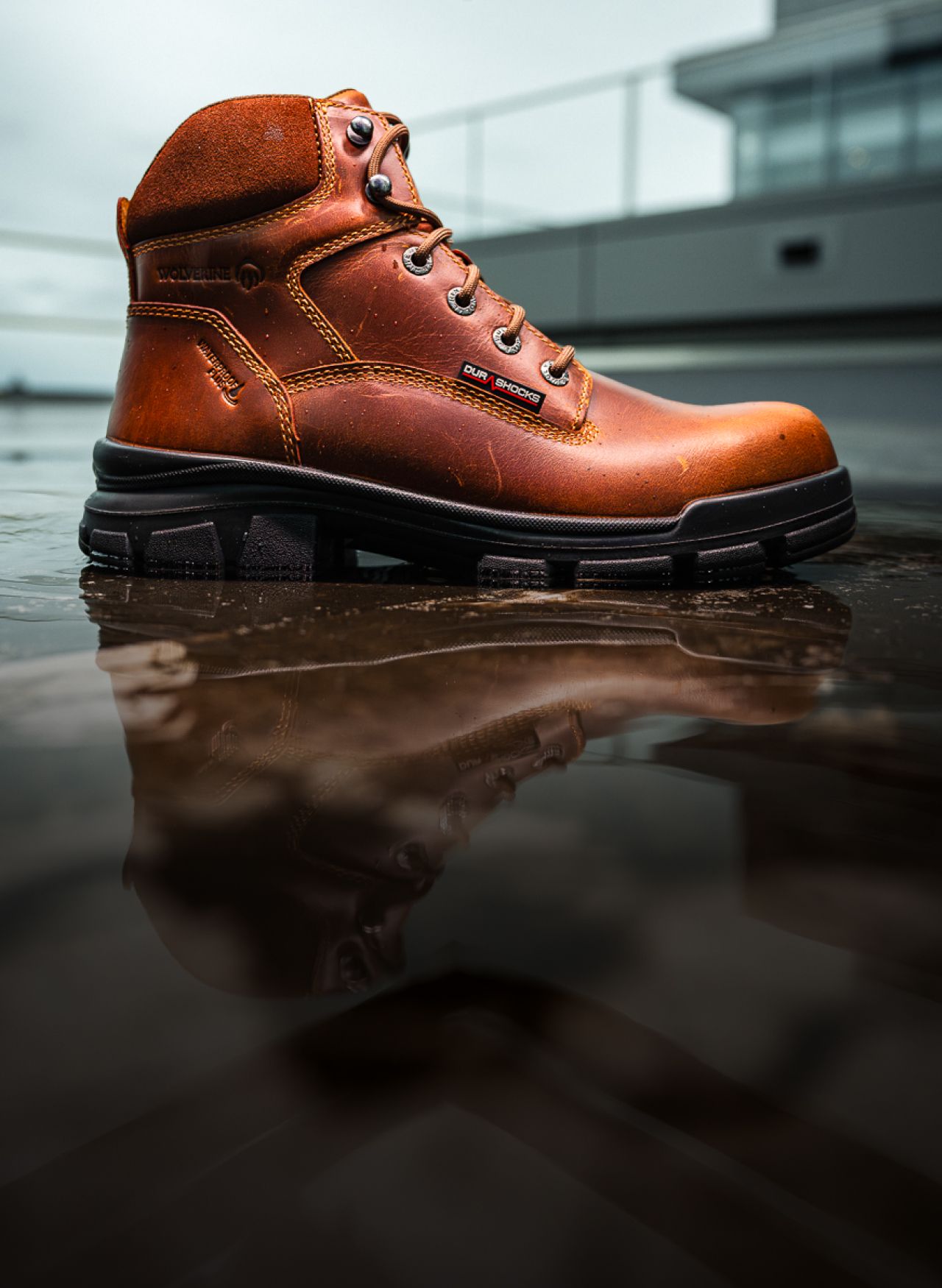 a brown boot on a wet floor