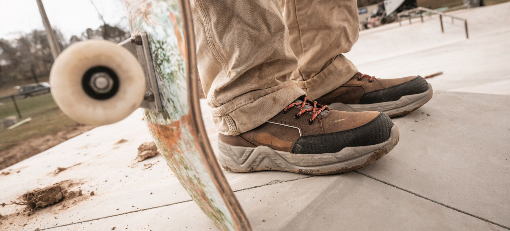 a person's feet with a skateboard