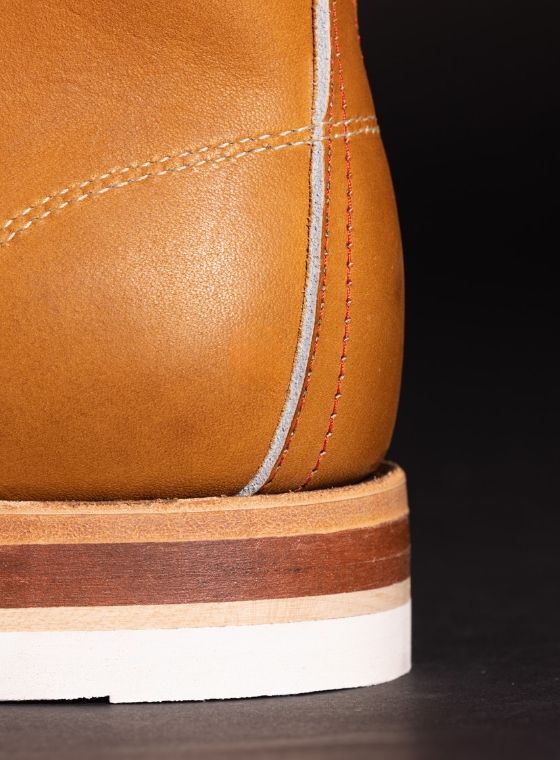 The heel of a tan leather boot.